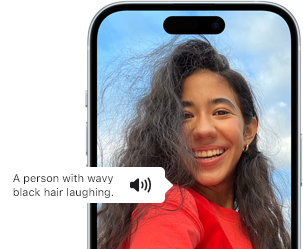 iPhone 15 showing Voiceover feature announcing the picture information: a person with wavy black hair laughing
