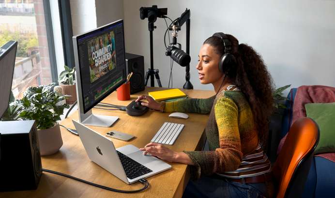 A student uses MacBook Neo, citrus colour, unplugged in a classroom setting